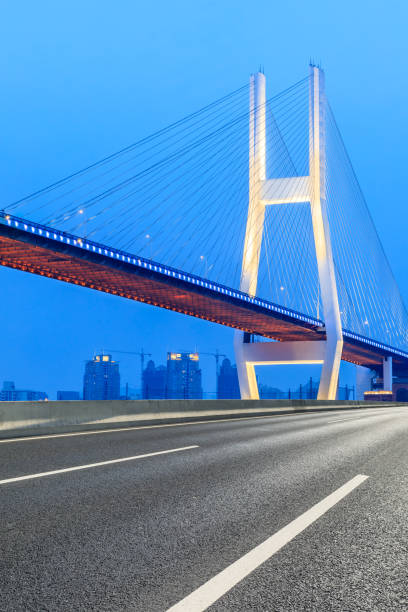 istock Shanghai Nanpu bridge and asphalt road scenery at night 1160385619