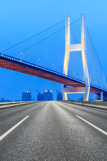 istock Shanghai Nanpu bridge and asphalt road scenery at night 1160385621