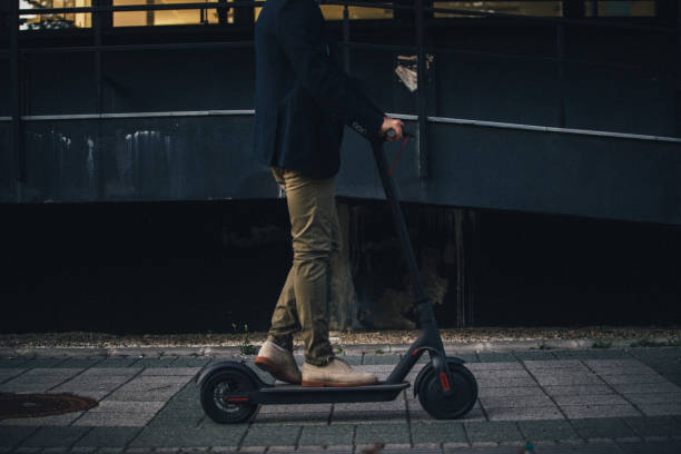 istock Hipster riding a scooter in the city 1160387084