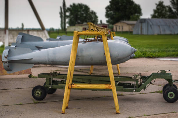 Aerial bombs fixed in line at closed military airfield.