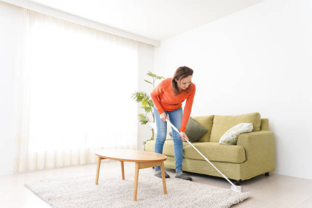 istock Young woman cleaning her house 1160391996