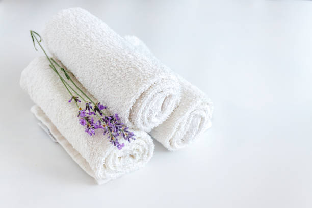 istock white clean towels and lavender flowers on white isolated background 1160395619
