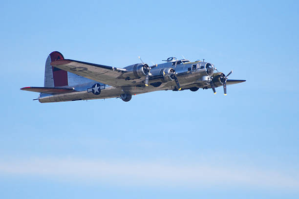 istock WWII bomber airplane B17 Flying Fortress flying in blue sky 116039778