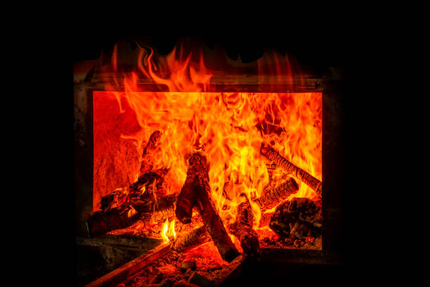 istock Charred wood and bright flames on dark background 1160398039