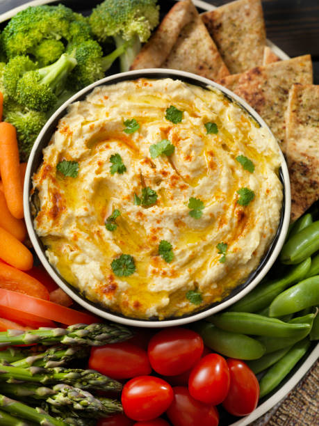 istock Roasted Garlic Hummus with Veggies and Pita Chips 1160398062