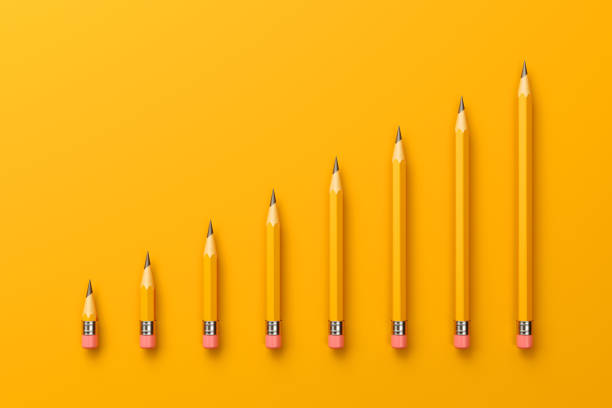 istock 2B Pencils Forming A Bar Graph on Yellow Background 1160399792