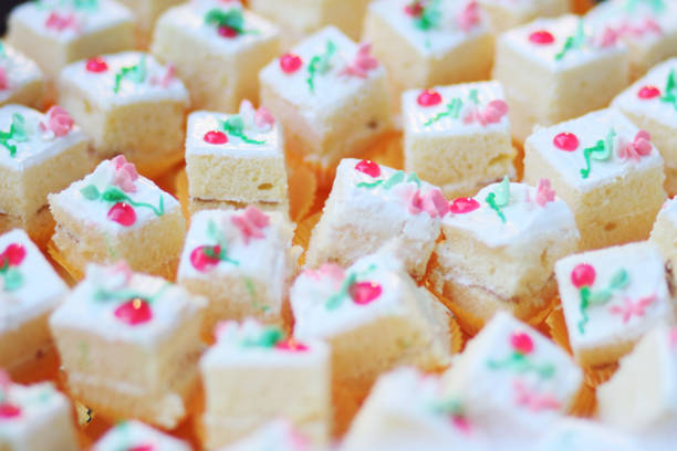 istock Homemade Square white cake  cream cubes dessert decorated on buffet table 1160399900
