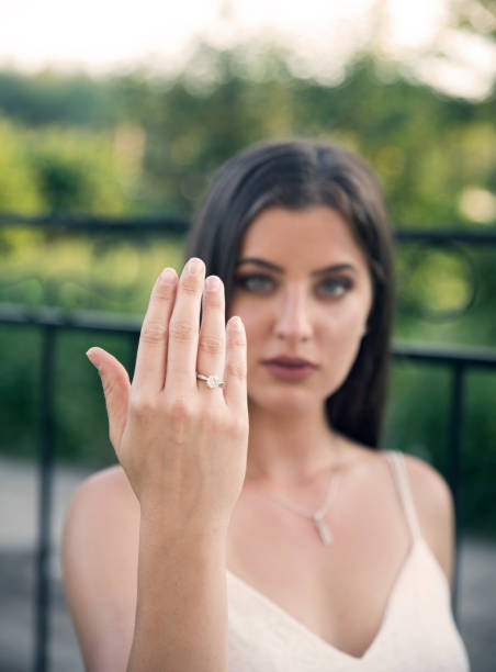 istock Woman showing diamond ring 1160400498