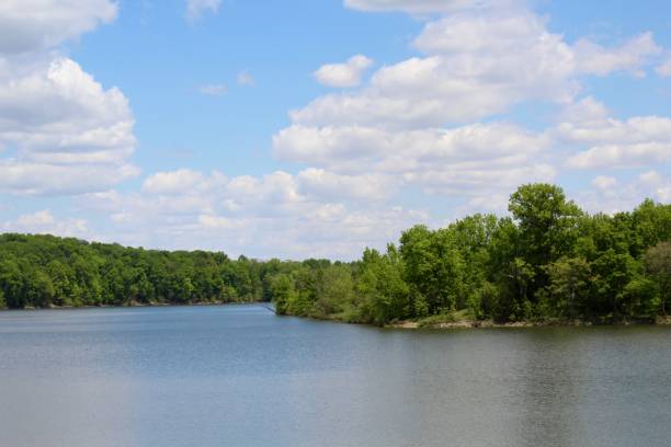 istock Lake and White Clouds in Sky 1160400592