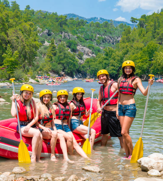 group of people white water rafting - team sport rafting white water rafting rapid imagens e fotografias de stock