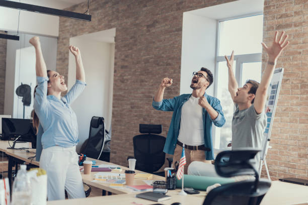 istock Happy young colleagues are rejoicing successful project 1160405098