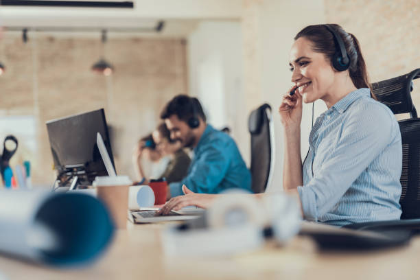 istock Happy young lady is working in the call center 1160405160