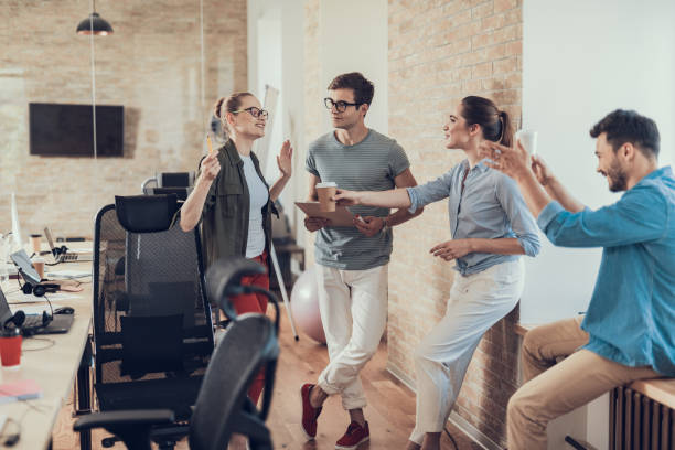istock Group of employees are enjoying coffee break in workroom 1160405174