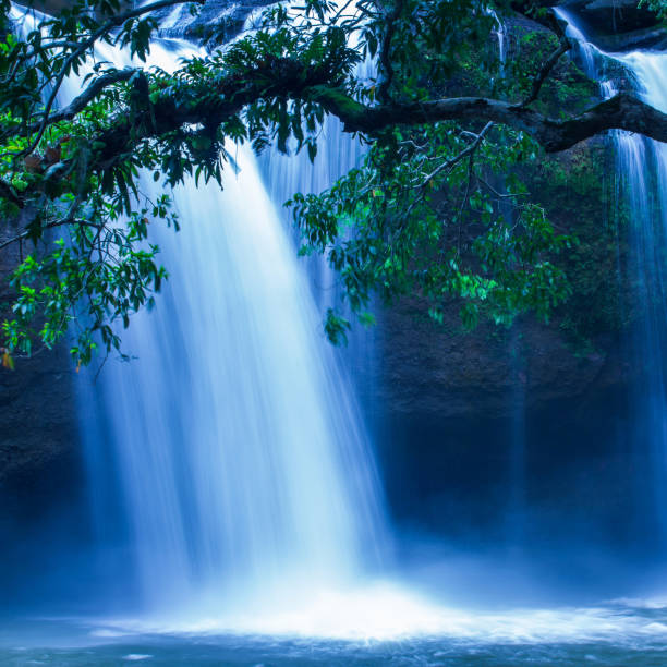 istock Picturesque tropical waterfall under the moonlight. 1160407912