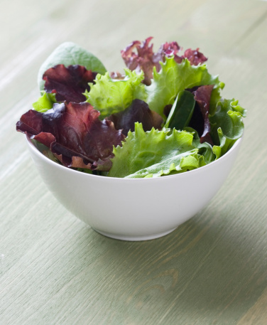 Bowl full of mixed lettuces.