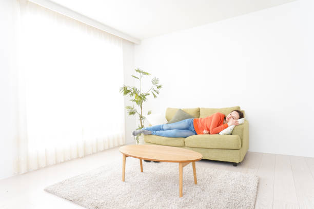 istock Woman taking a nap at home 1160410349