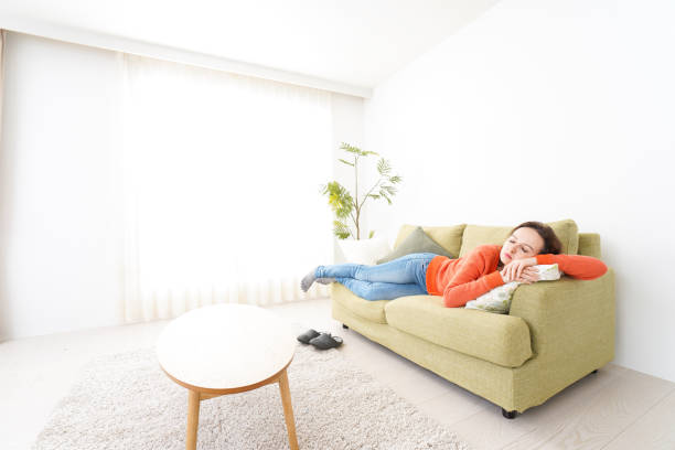 istock Woman taking a nap at home 1160410353