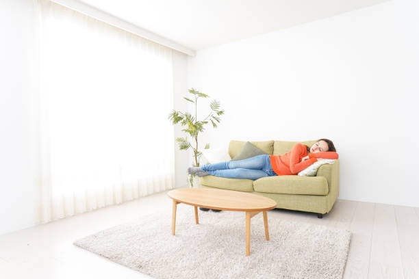 istock Woman taking a nap at home 1160410356