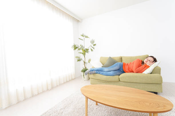 istock Woman taking a nap at home 1160410360