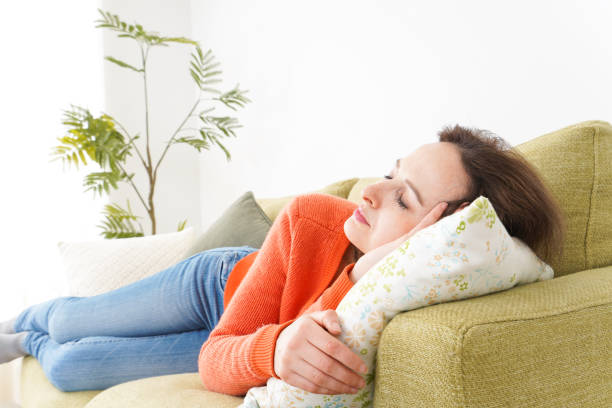 istock Woman taking a nap at home 1160410377