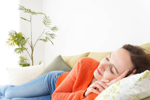 istock Woman taking a nap at home 1160410382