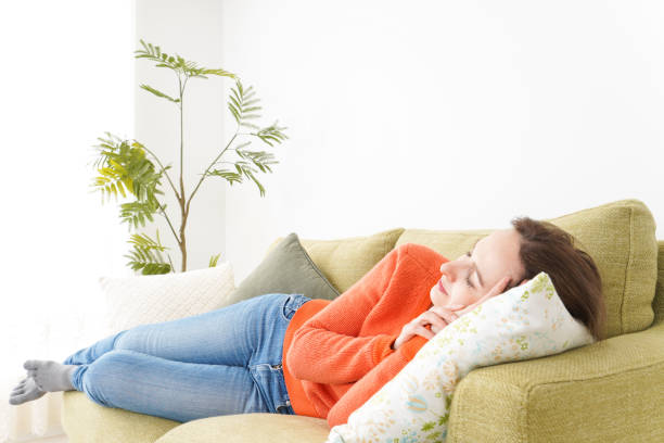 istock Woman taking a nap at home 1160410386