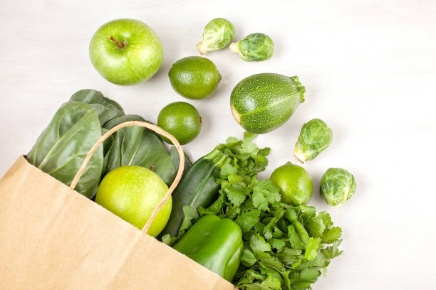 istock Top view of fresh organic vegetables in green colo 1160410542