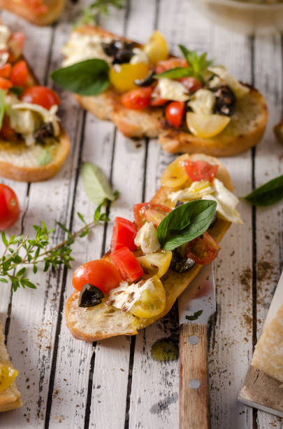 istock Crostini with tomatoes and olives 1160411655