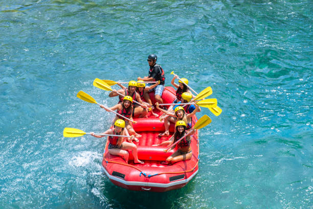 istock Group of people white water rafting 1160411740