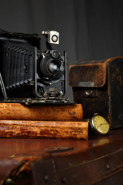 istock Retro camera, clock and antique books 1160413192