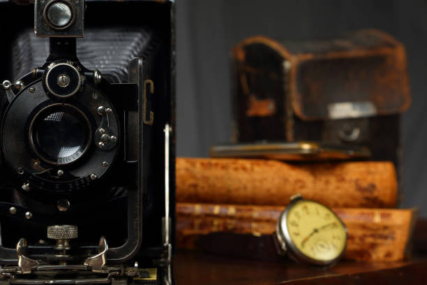 istock Retro camera, clock and antique books 1160413195