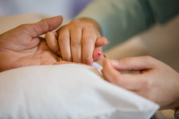 istock Process of drawing blood from a finger for hematocrit test. 1160413487