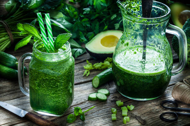 istock Healthy drink: green vegetables juice on rustic wooden table 1160415687