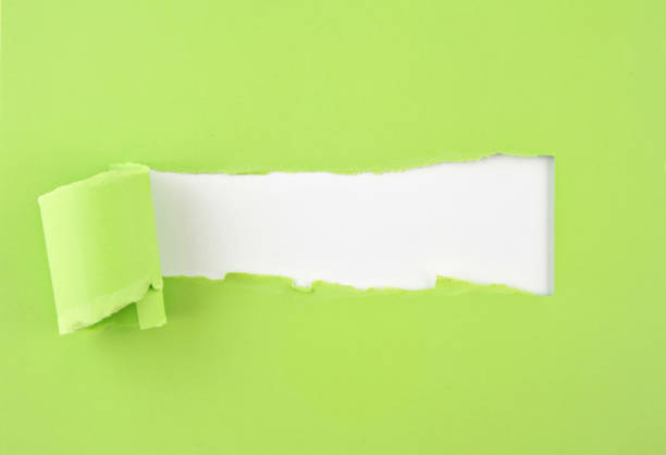 istock Torn colored paper, hole in the sheet of paper 1160418152