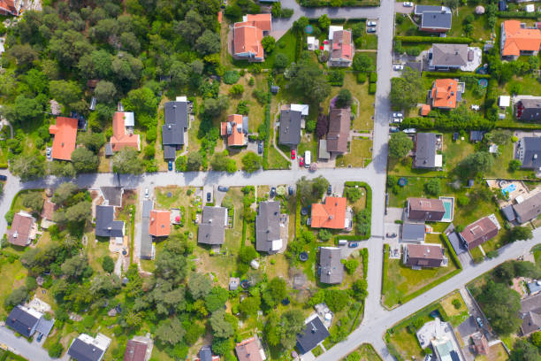 istock Top view, flying over idyllic villa area 1160418412