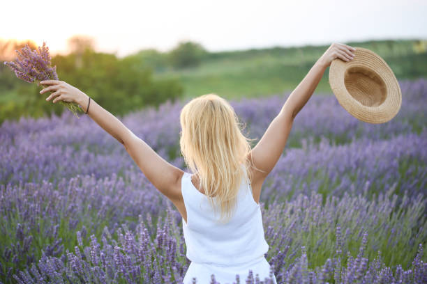 istock Young woman in a lavender field 1160419218