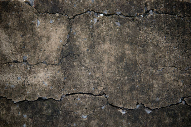 Cracked grunge rough cement concrete texture surface background stock photo