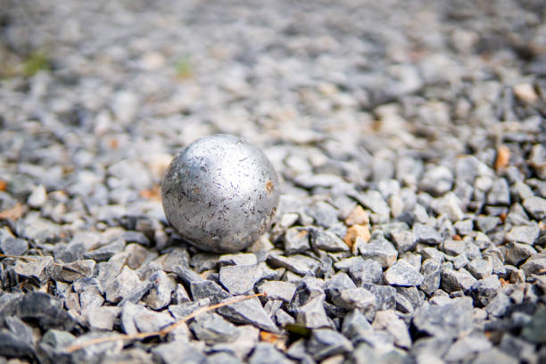 Three petanque balls with the bowling alley.
