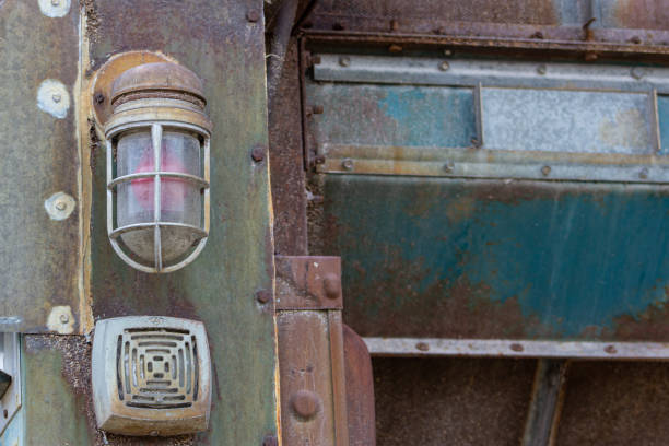 Close-up of lightbulb on blue and silver antique silo