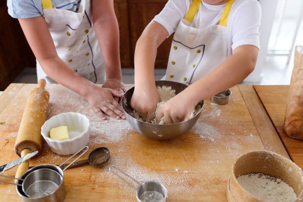 istock Kids Helping in the Kitchen. Brother and sister baking. 1160422283