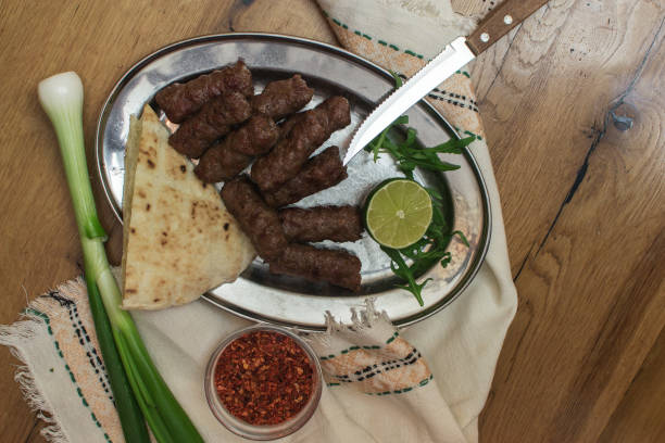 istock Kebabs - grilled meat, bread and vegetables. 1160423145
