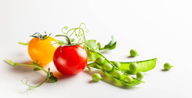 istock Fresh green  peas pods with sprouts and cherry tomatoes 1160425059