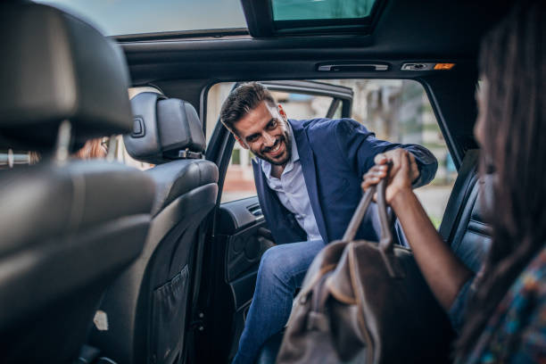 istock Man with bag entering car 1160427370