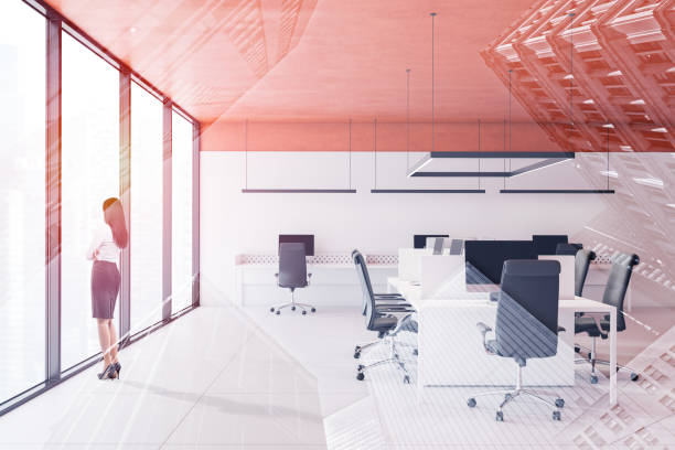 istock Businesswoman in orange ceiling office 1160429894