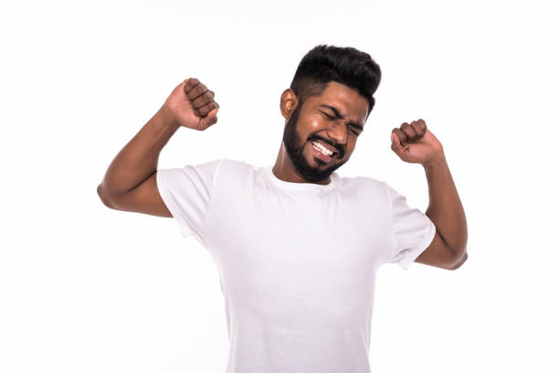 istock Young indian man stretching his arms isolated on white background 1160429947
