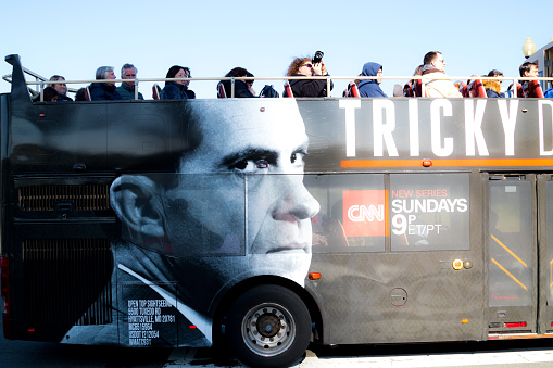 Washington, DC, USA â April 1, 2019: Local metro bus with advertisement for Richard Nixon TV program