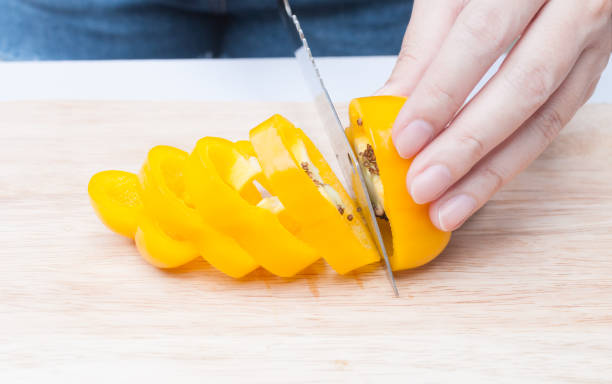 istock Fresh Yellow bell pepper sliced on wooden 1160436740