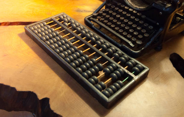 istock Retro abacus and Typewriter ancient on wooden 1160436861