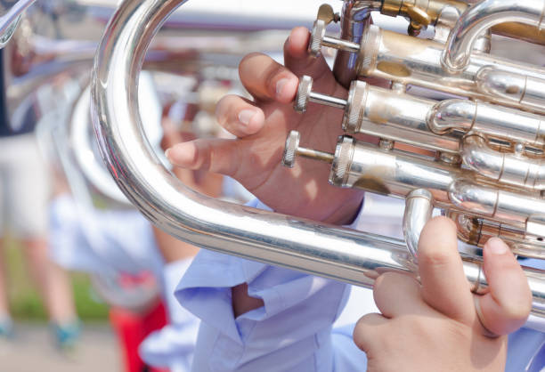 istock Human hand playing the flugelhorn 1160436884