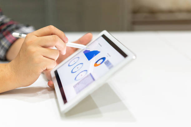 istock close up businessman hand using stylus pen on screen dashboard of graph and chart statistics data for analyzing about profit monthly , business and financial concept 1160440608